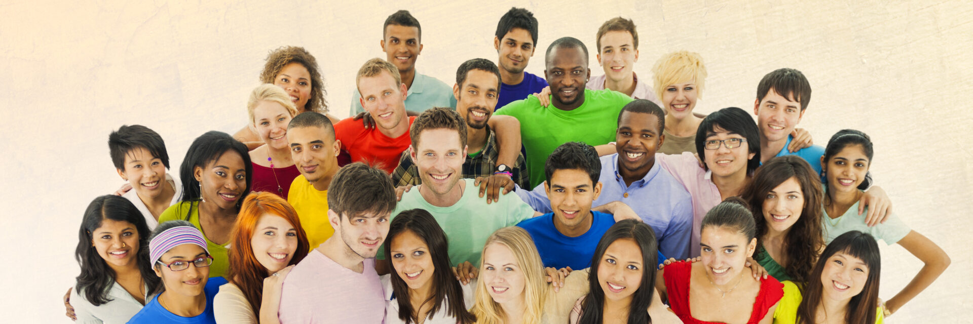 A group of people that are smiling for the camera.